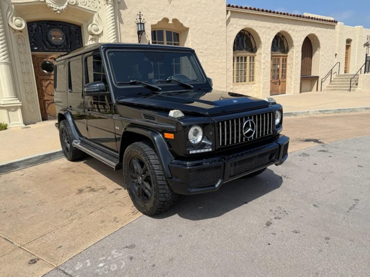 Black Mercedes G-Class parked on a street