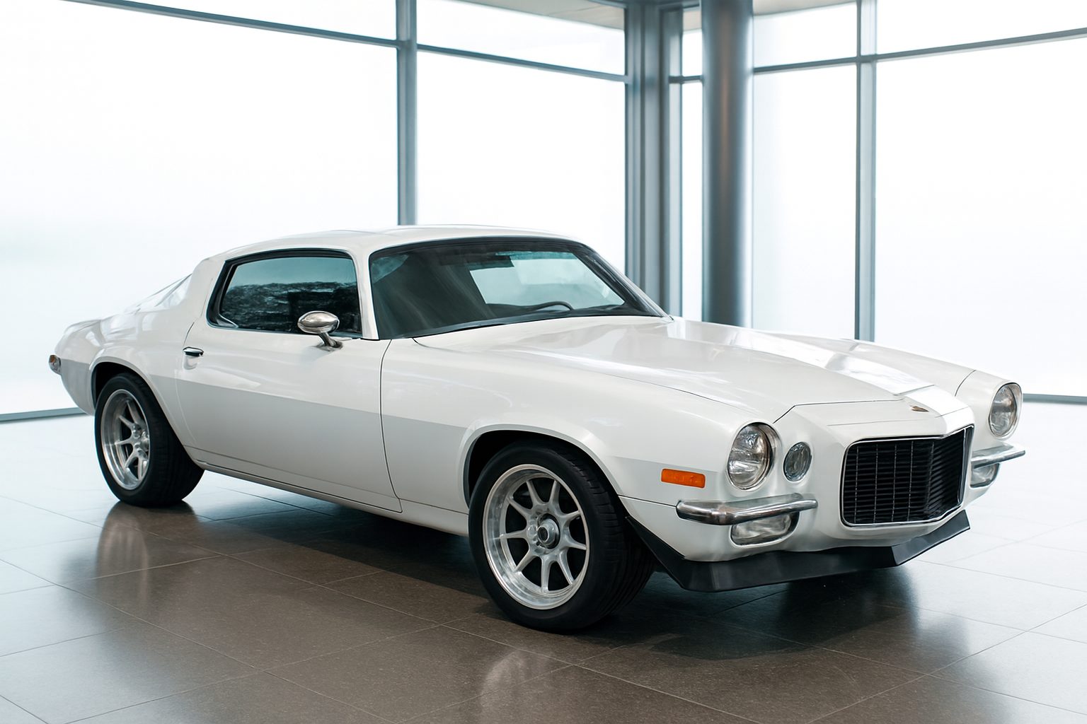 Same Camaro restaged in a glass atrium showroom
